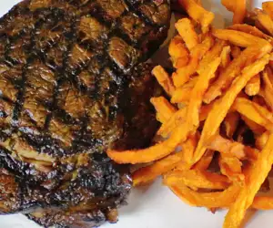 Grilled steak and sweet potato fries. 