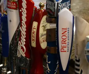 Taps handles for each of the beers on draft. 