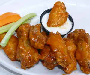 Tasty chicken wings with blue cheese dipping sauce. 