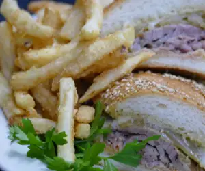 Tasty sandwich with french fries. 